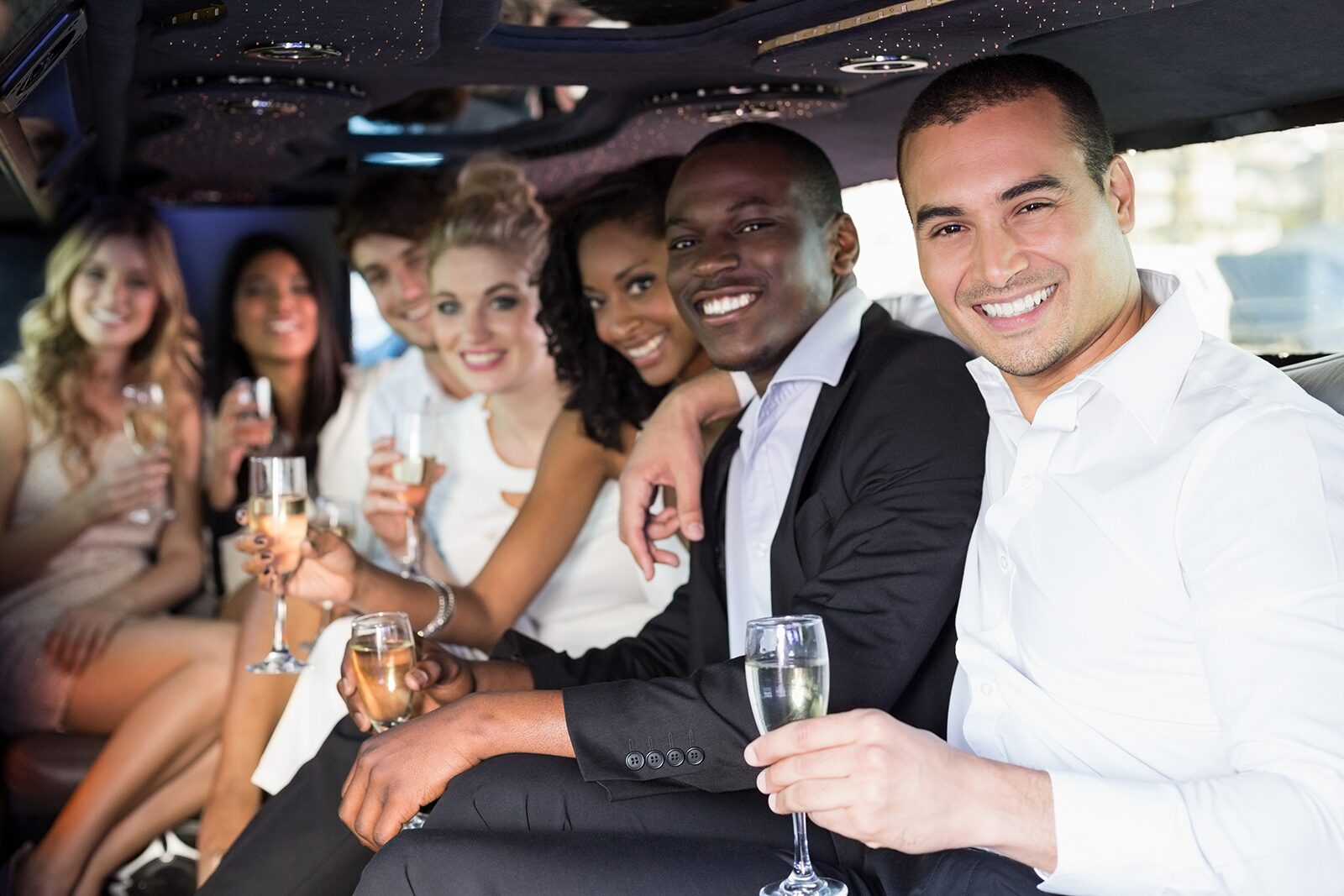 happy group in limousine